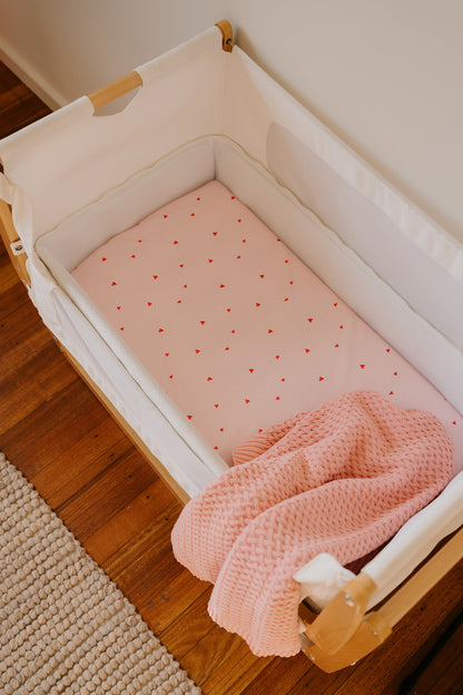 The Two-Sheet Set: two organic cotton waterproof fitted sheets in Darling Heart and Tiny Teddy prints